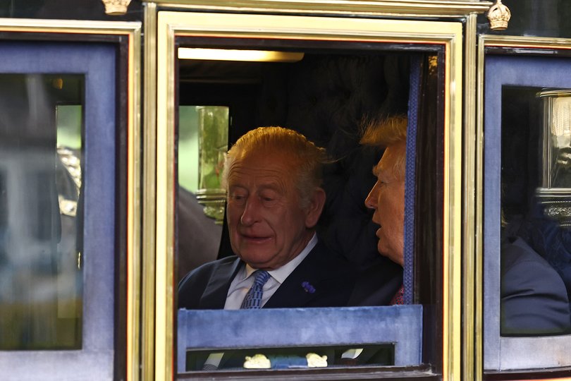 King Charles III and US President Donald Trump travel in The Irish State Coach during a horse-drawn procession towards Windsor Castle.
