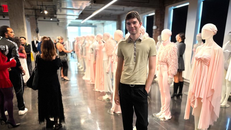 Jake Henry Smith wears Uniqlo slacks and a Katharine Hamnett shirt to a Norma Kamali presentation in Greenwich Village. 