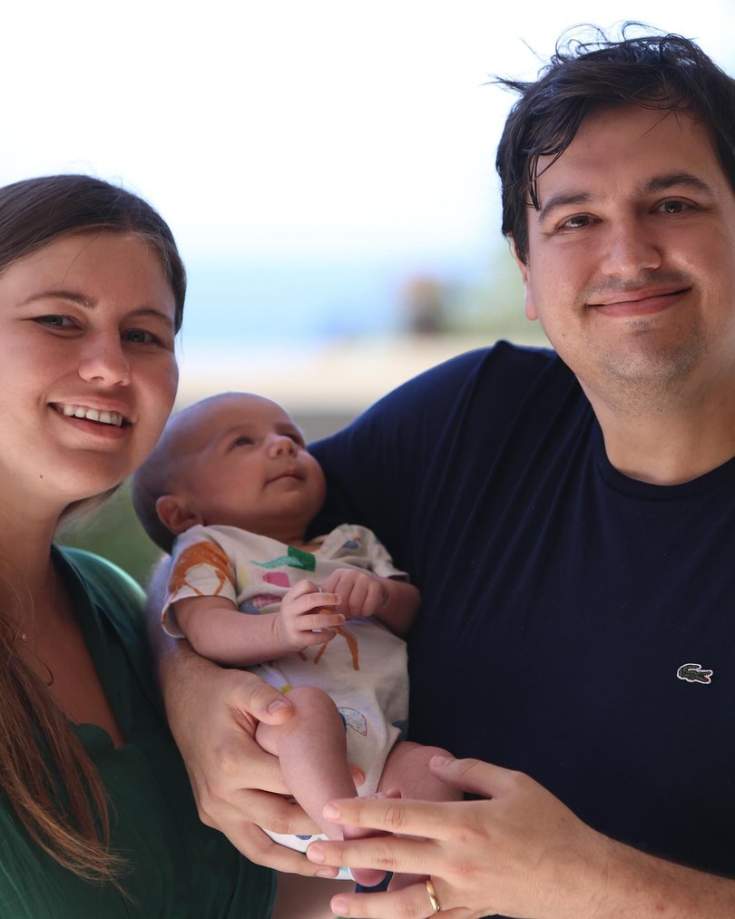 Ms Higgins with husband David Sharaz and their baby Frederick Leon.