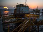 Gas flares burn from pipes aboard an offshore oil platform in the Persian Gulf's Salman Oil Field, operated by the National Iranian Offshore Oil Co., near Lavan island, Iran, on Thursday, Jan. 5. 2017. Nov. 5 is the day when sweeping U.S. sanctions on Iran’s energy and banking sectors go back into effect after Trump’s decision in May to walk away from the six-nation deal with Iran that suspended them. Photographer: Ali Mohammadi/Bloomberg