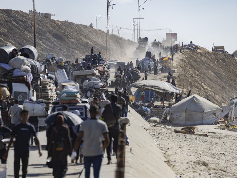 People flee along the coastal Rashid Street from Gaza City, on Tuesday, September 16, 2025.
