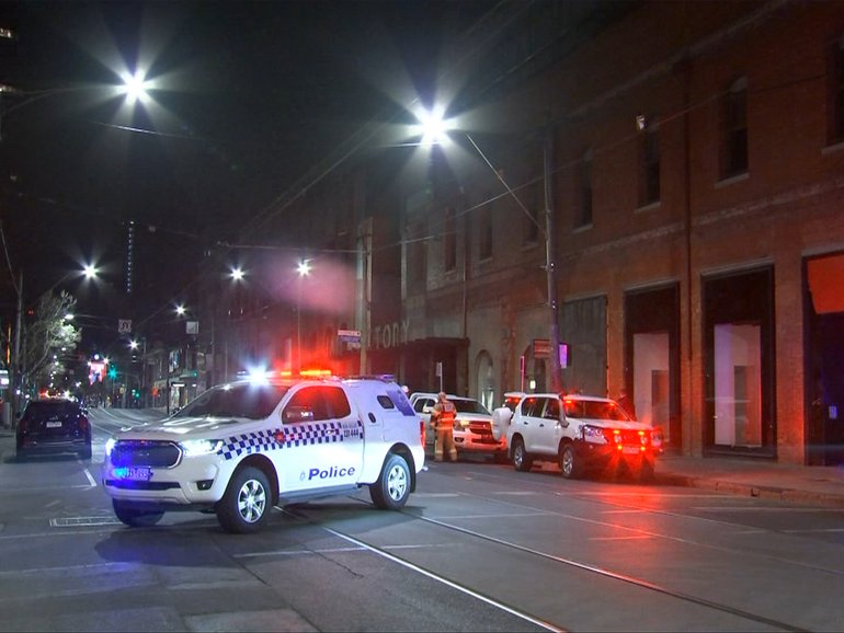 Police outside the old Jam Factory site on Chapel St in South Yarra.