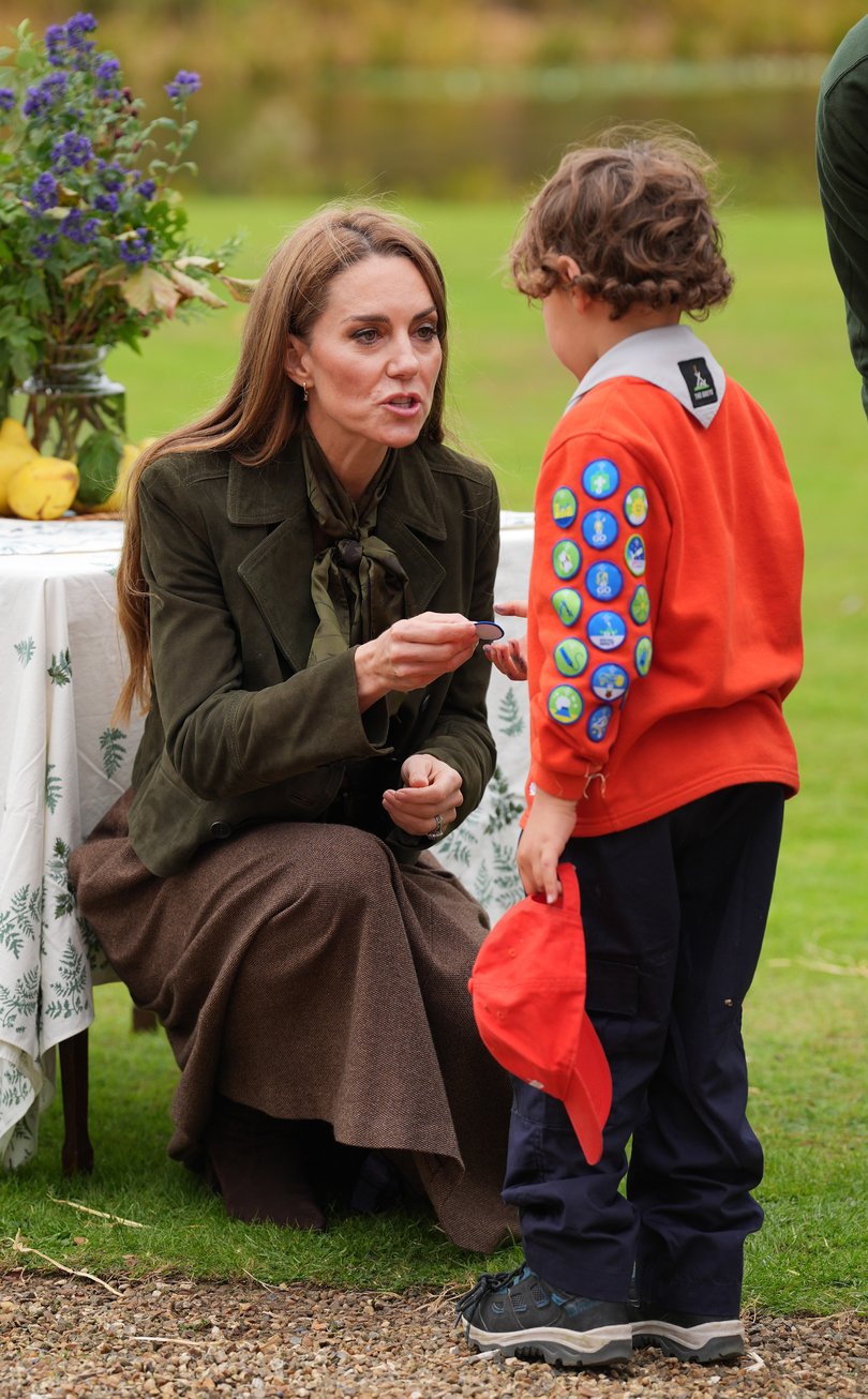 Catherine, Princess of Wales presents "Go Wild" badges as she meets members of the Scouts' Squirrels program.