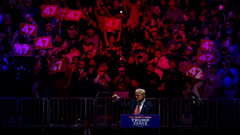 President-elect Donald Trump takes the stage during a rally in Capital One Arena, Washington, the day before his inauguration.