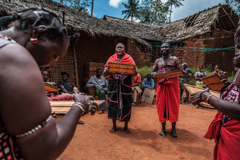 Chonyi women perform traditional music and dance in the Chasimba area of Kilifi County, Kenya, Oct. 15, 2024. The community fought a battle few believed it could win when an Emirati-backed company aimed to bulldoze over 600 acres of land, including most of the caves.