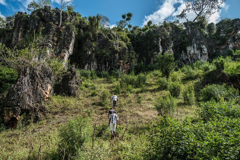 Visitors walk near the caves in the Chasimba area of Kilifi County, Kenya, Oct. 15, 2024. Some see the caves as part of irreplaceable heritage.