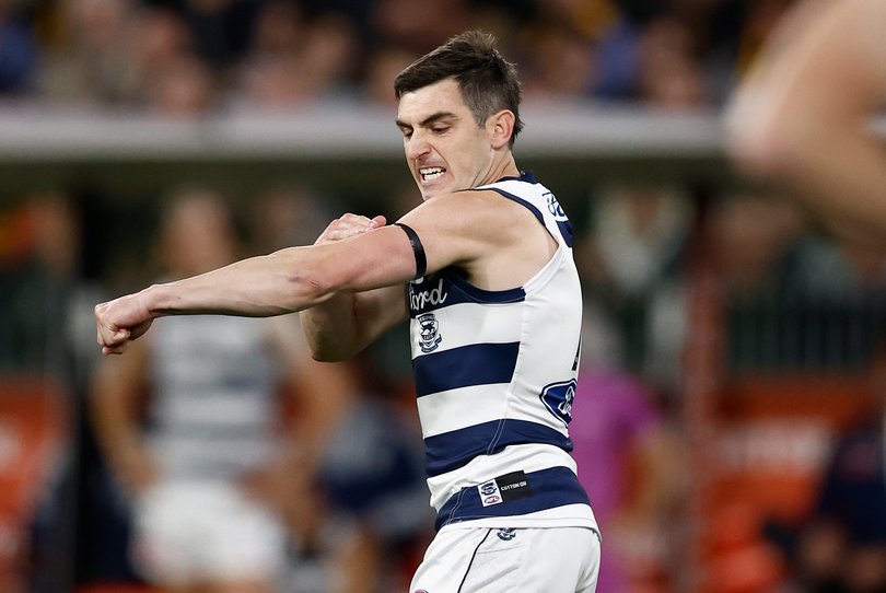 MELBOURNE, AUSTRALIA - SEPTEMBER 19: Shaun Mannagh of the Cats slaps his black armband after kicking a goal during the AFL Second Preliminary Final match between the Geelong Cats and the Hawthorn Hawks at the Melbourne Cricket Ground on September 19, 2025 in Melbourne, Australia. (Photo by Michael Willson/AFL Photos)
