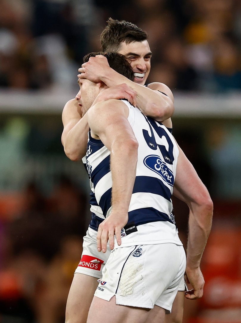 Patrick Dangerfield (left) and Shaun Mannagh of the Cats celebrate.