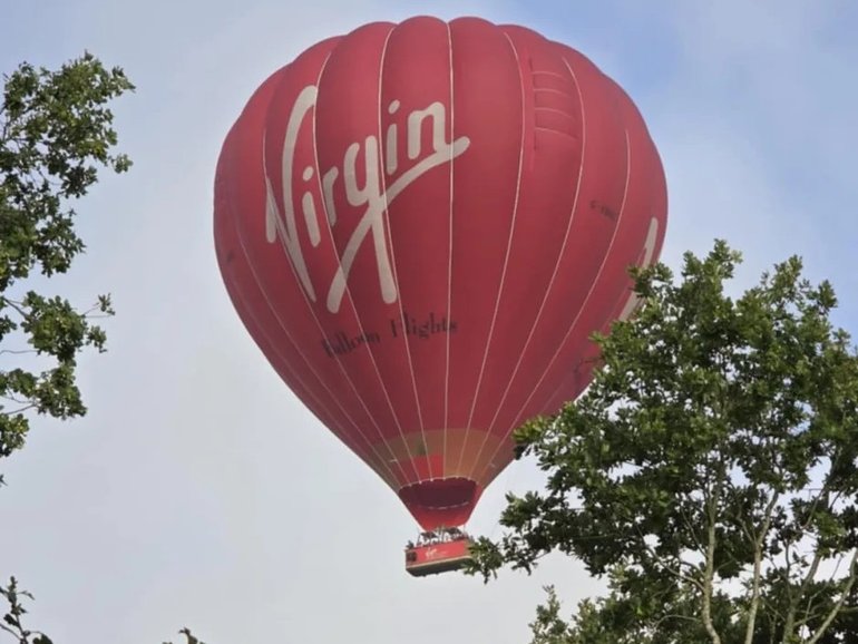 A man jumped from the basket of the hot air balloon. 