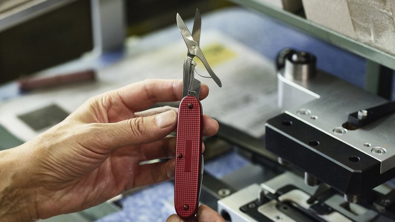 An employee assembles a knife at the Victorinox Swiss Army knife factory in Ibach-Schwyz, Switzerland.
