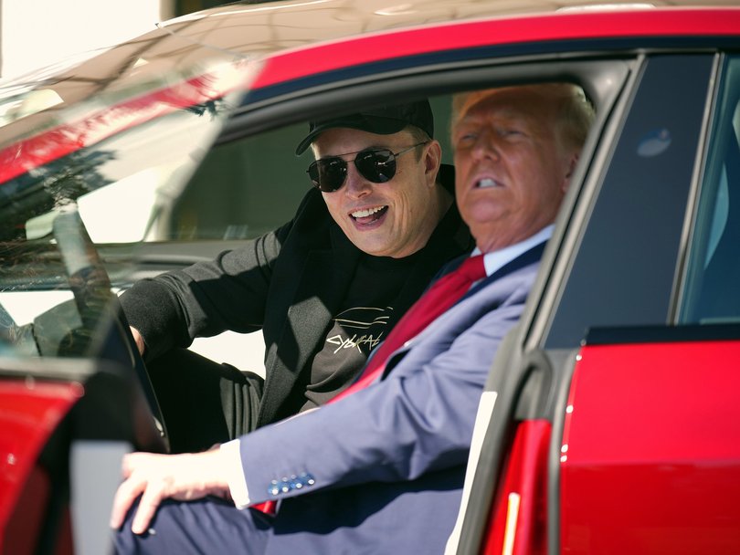 Elon Musk with US President Donald Trump spruiking Tesla in happier times. 