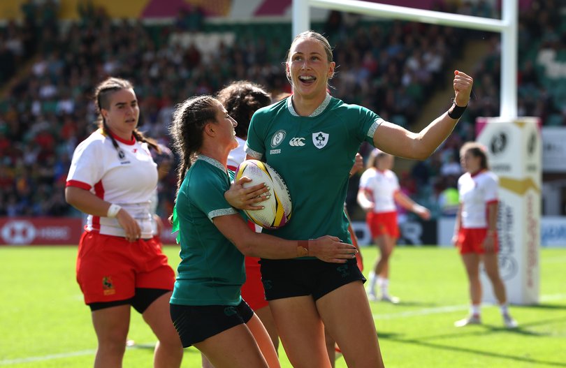 Anna McGann celebrates after scoring a try against Spain.