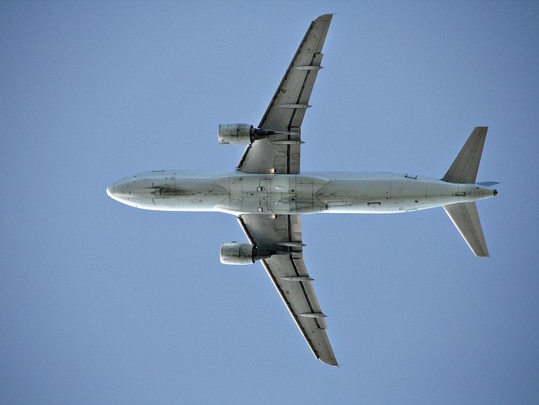 Police were waiting to arrest the man when the plane landed.