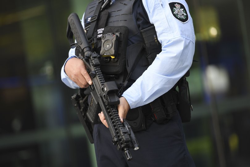 An Australian Federal Police officer holding an MK18 Short Barrelled Rifle.