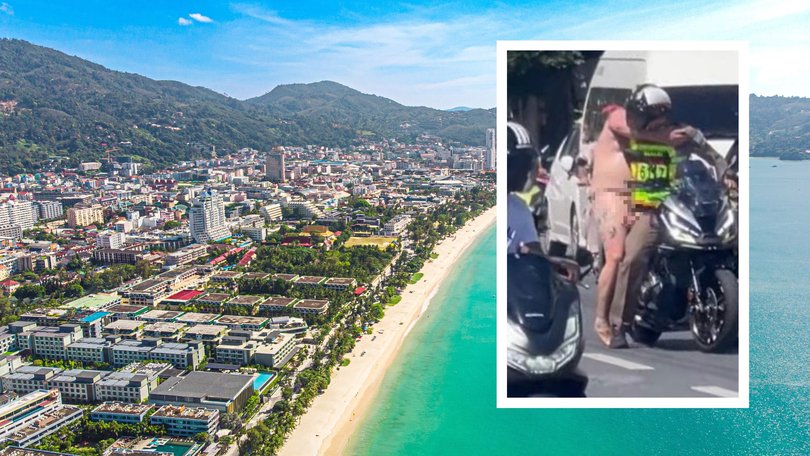 Shocked onlookers filmed the man as he stormed along Patong’s main strip in Phuket on Monday.