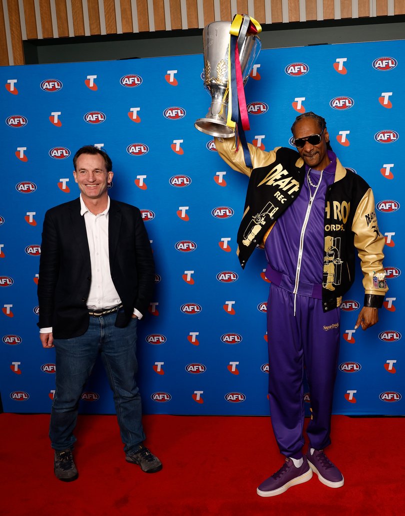 AFL CEO Andrew Dillon with Snoop Dogg holding the premiership cup.