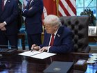 US President Donald Trump signs an executive order transferring control of TikTok’s US operations.