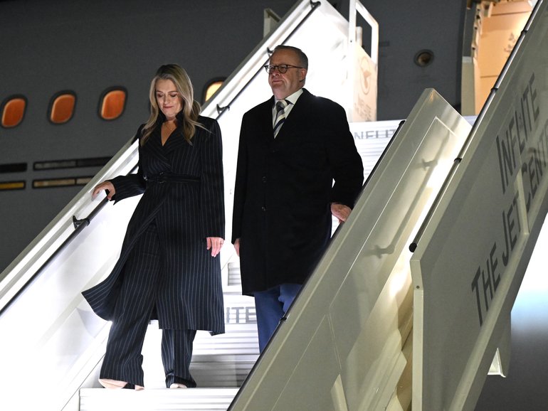 Prime Minister Anthony Albanese and partner Jodie Haydon disembark on arrival at Stansted airport in London.