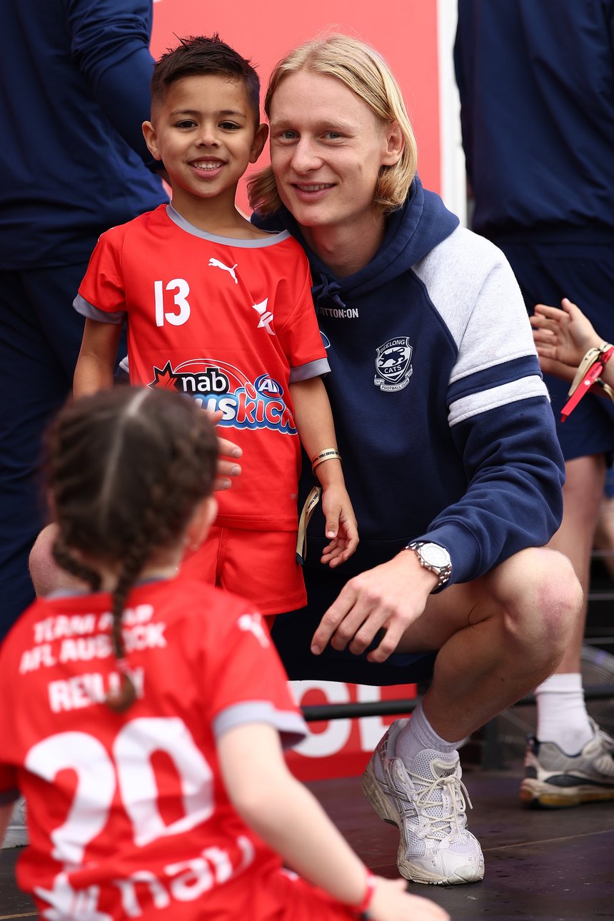 Ollie Dempsey of the Cats is seen with an NAB Auskicker.