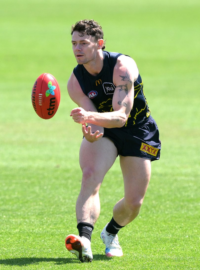 Lachie Neale handballs during a Brisbane Lions AFL training session at Brighton Homes Arena on September 23, 2025 in Ipswich, Australia.