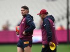Lachie Neale of the Lions (left) and Brisbane Lions head coach Chris Fagan during a Brisbane Lions Captains run. 