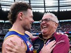 Lachie Neale and Chris Fagan embrace after the win.