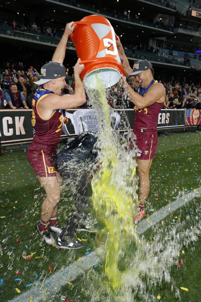 Dayne Zorko and Cam Rayner tip Gatorade on Chris Fagan.
