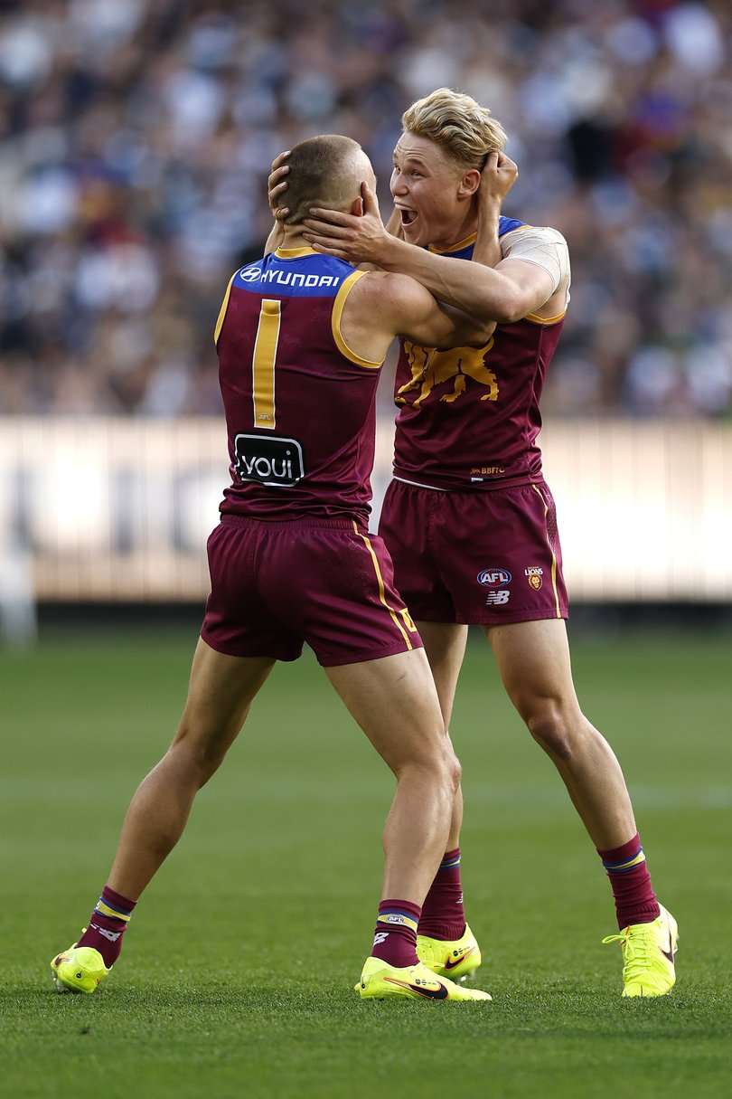 Kai Lohmann of the Lions celebrates a goal with Levi Ashcroft of the Lions.