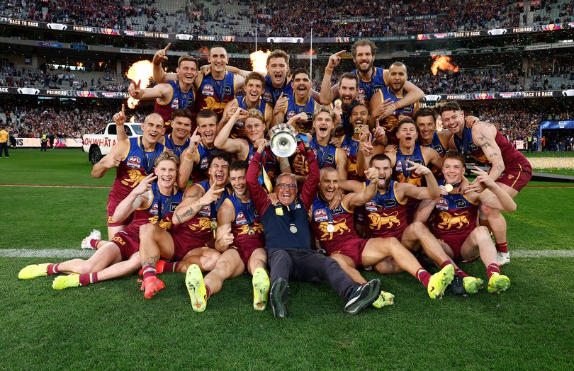 The Lions pose for their team photo after winning.