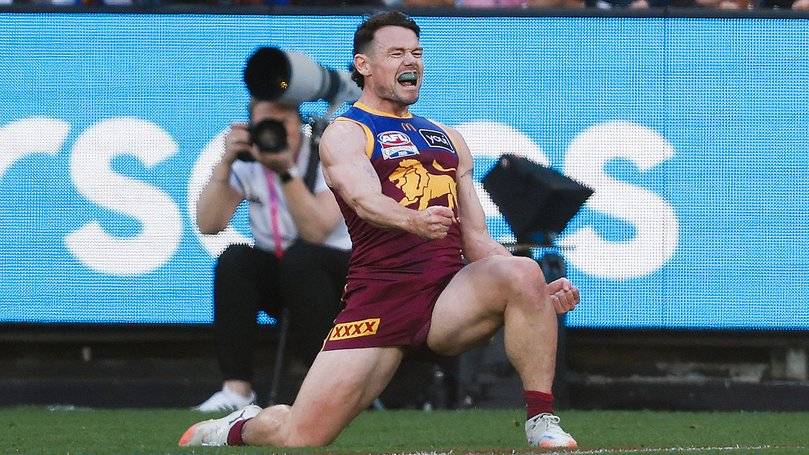 Lachie Neale of the Lions celebrates a goal.