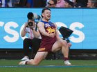 Lachie Neale of the Lions celebrates a goal.