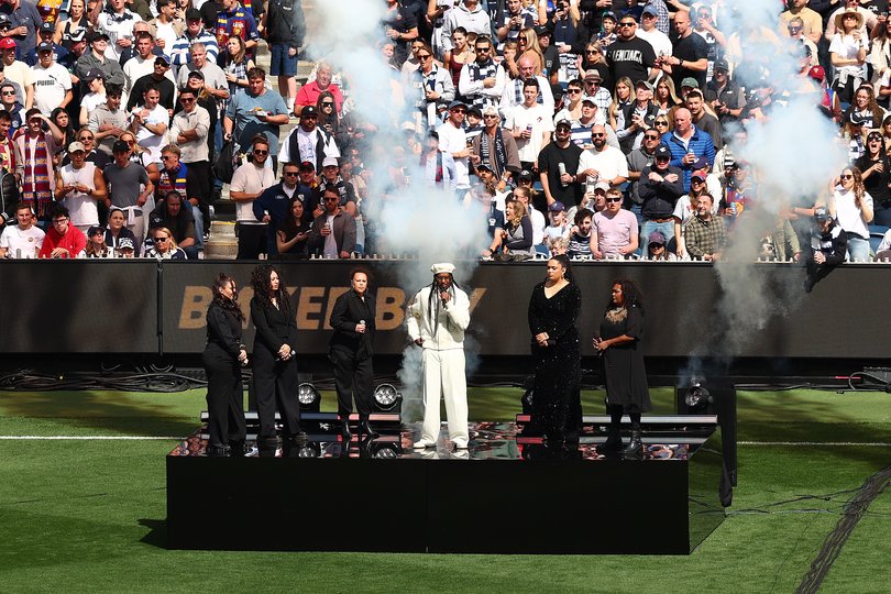 MELBOURNE, AUSTRALIA - SEPTEMBER 27: Baker Boy and Choir featuring Emma Donovan & Kee’ahn perform prior to the AFL Grand Final match between Geelong Cats and Brisbane Lions at Melbourne Cricket Ground on September 27, 2025 in Melbourne, Australia. (Photo by Graham Denholm/AFL Photos/via Getty Images)