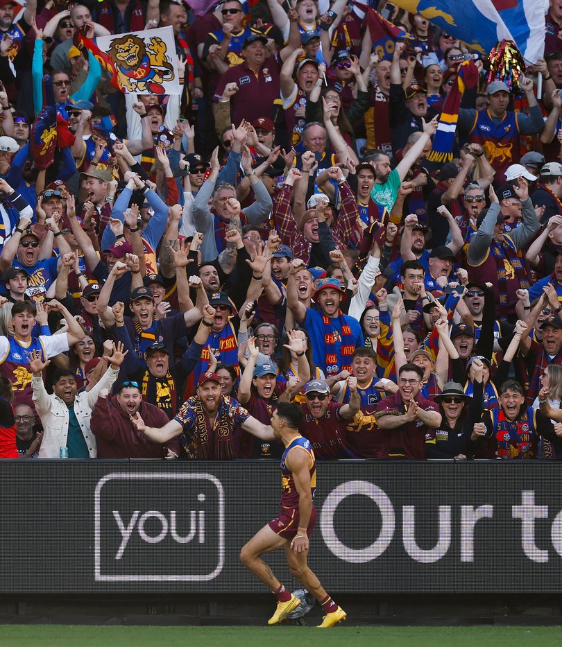 Charlie Cameron of the Lions celebrates a goal.