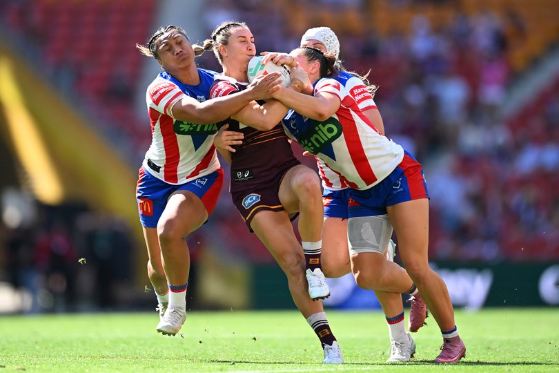BRISBANE, AUSTRALIA - SEPTEMBER 28: Lauren Dam of the Broncos is tackled during the NRLW preliminary final match between Brisbane Broncos and Newcastle Knights at Suncorp Stadium, on September 28, 2025, in Brisbane, Australia. (Photo by Albert Perez/Getty Images)