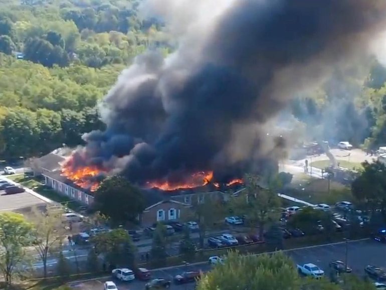 Authorities suspect a fire that broke out during a shooting was intentionally set by the attacker. (AP PHOTO)