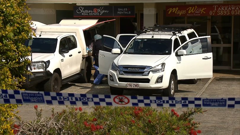 Police at the scene in Manly West, Queensland. 