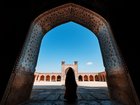 A Woman standing among the Ancient Mosque, Shiraz, Iran.