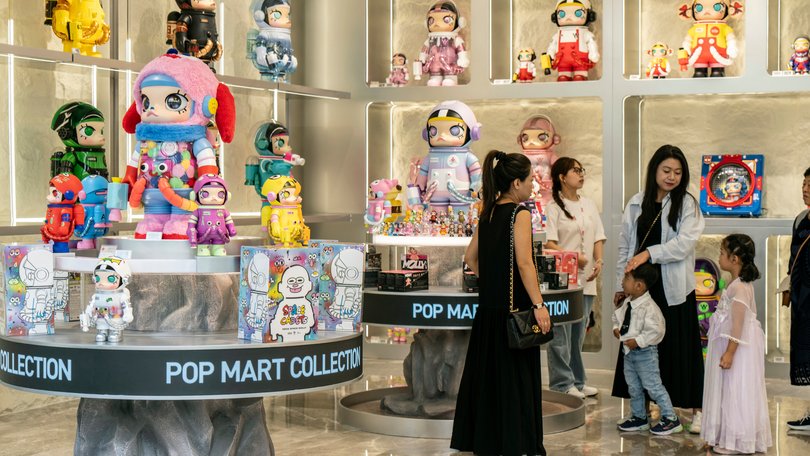Shoppers check out Molly inside a Pop Mart store in Chengdu, China.