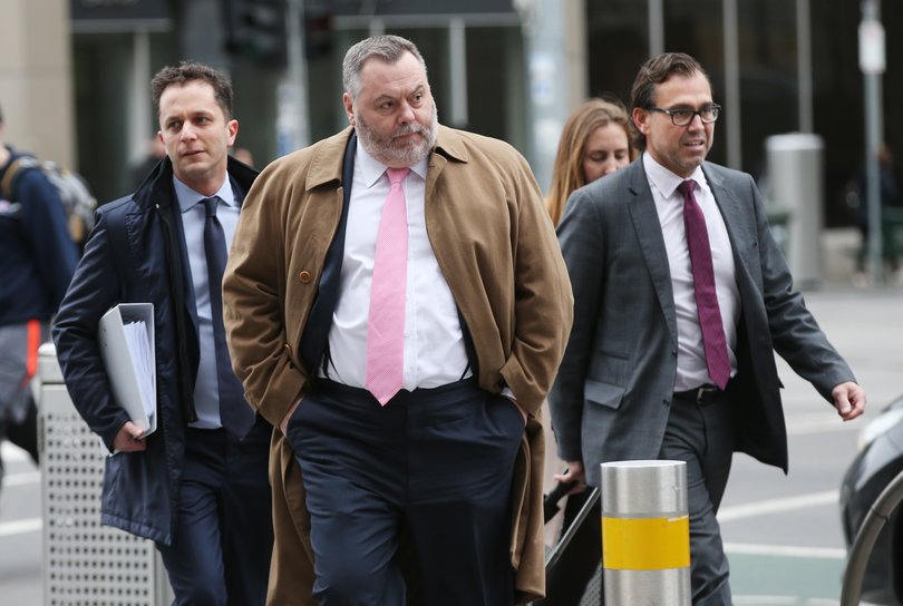 Melbourne barrister Stuart Wood (centre) at the Federal Court in Melbourne in 2019. He is conducting an inquiry into the Queensland CFMEU.