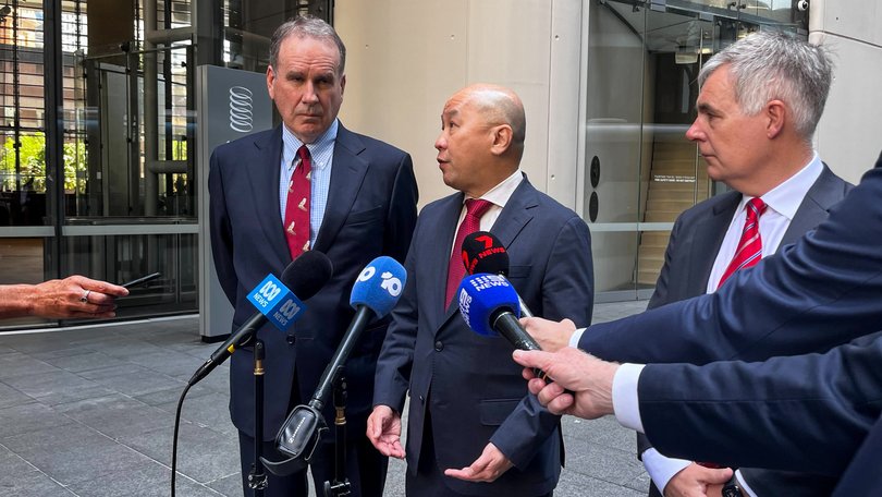 Optus chairman John Arthur, Singtel CEO Yuen Kwan Moon and Optus CEO Stephen Rue speak to the media  in Sydney on Tuesday.