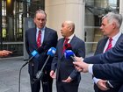 Optus chairman John Arthur, Singtel CEO Yuen Kwan Moon and Optus CEO Stephen Rue speak to the media  in Sydney on Tuesday.