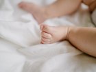 A couple charged over allegedly breaking a four-week-old baby’s leg have been slapped with strict bail conditions. 