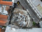 This aerial shot taken with a drone shows the rubble of a building that collapsed at the compound of an Islamic boarding school in Sidoarjo, East Java, Indonesia, Tuesday, Sept. 30, 2025. (AP Photo/Trisnadi)