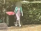 CCTV captures the woman taking out the bins at the luxury Airbnb just a day before she and her daughter were found dead.