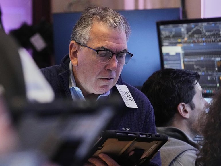 Wall Street indexes have closed higher with the biggest boost coming from healthcare stocks. (AP PHOTO)