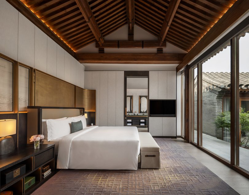 The Mandarin Oriental Qianmen features a courtyard bedroom that blends traditional Beijing architecture with modern luxury and serene privacy.