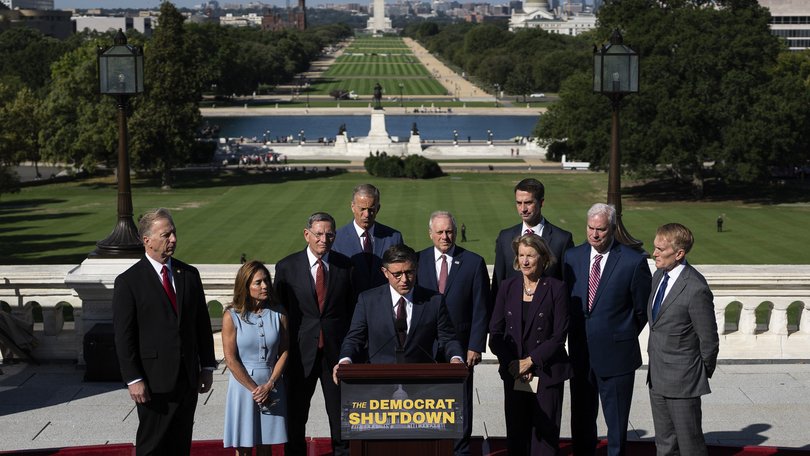 House Speaker Mike Johnson speaks at a news conference with Republican leadership on the first day of a partial government shutdown outside the Capitol.