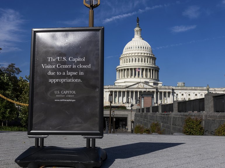 Signage outside the Capitol Hill visitors center notifies the public of its closure due to the government shutdown in Washington.