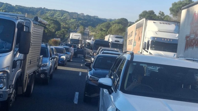 Pacific Highway has been plunged into chaos after several crashes left at least two people dead. 