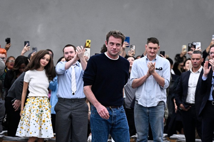 Fashion designer Jonathan Anderson acknowledges the audience at the end of Dior's fashion show for the Women Ready-to-wear Spring-Summer 2026 collection as part of the Paris Fashion Week.